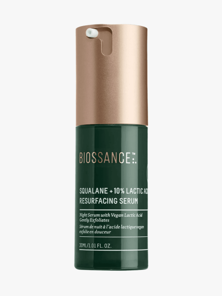 Biossance Squalane + 10% Lactic Acid Resurfacing Night Serum in dark green bottle with muted gold pump on light gray background